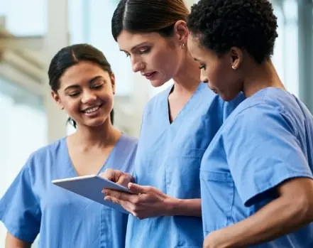 Nurses looking at tablet